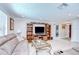 Comfortable living room with tile flooring, built-in shelving, and a cozy seating area at 2818 Cedaridge Dr, Tampa, FL 33618