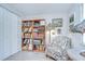 Comfortable living room features a bookshelf, chair, and a closet, perfect for relaxing and storage at 2818 Cedaridge Dr, Tampa, FL 33618