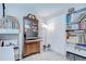Well-organized office space featuring a closet, display cabinet and a printer for enhanced productivity at 2818 Cedaridge Dr, Tampa, FL 33618