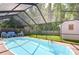 Inviting screened-in pool area with comfortable seating, perfect for relaxing or entertaining at 2818 Cedaridge Dr, Tampa, FL 33618