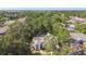 Aerial shot of a home nestled among lush trees in a residential neighborhood at 2901 50Th E Pl, Bradenton, FL 34203