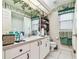 Well-lit bathroom with white vanity and green accents at 2901 50Th E Pl, Bradenton, FL 34203