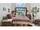 Cozy bedroom features a large window and comfortable bed at 2901 50Th E Pl, Bradenton, FL 34203