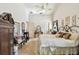 Bedroom with large window, neutral carpet, and ceiling fan at 2901 50Th E Pl, Bradenton, FL 34203