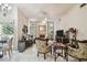 Living room with a large ceiling fan, a fireplace, and access to lots of natural light at 2901 50Th E Pl, Bradenton, FL 34203