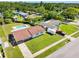Aerial view of the home's front and back yards and surrounding neighborhood with mature trees at 302 Patty Dr, Oldsmar, FL 34677