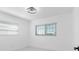 Bright bedroom with modern windows, lighting, and neutral decor at 302 Patty Dr, Oldsmar, FL 34677
