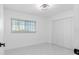 Bright bedroom featuring a closet, neutral walls, and natural light from the window at 302 Patty Dr, Oldsmar, FL 34677