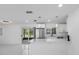 Island kitchen with stainless steel appliances, quartz countertop, and view of pool area at 302 Patty Dr, Oldsmar, FL 34677