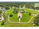 Aerial view of a park featuring manicured lawns, walking paths, and a central gazebo at 302 Patty Dr, Oldsmar, FL 34677