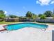 Beautiful pool and outdoor living area with a well-maintained fence line, great for staying private at 302 Patty Dr, Oldsmar, FL 34677
