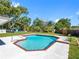 Backyard view of the pool and patio area, perfect for relaxing and entertaining outdoors at 302 Patty Dr, Oldsmar, FL 34677