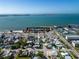 An aerial view showcases the property's location near a beautiful beach and bay at 3108 Dupont S St, Gulfport, FL 33707
