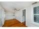 Sunroom with hardwood floors and white walls, bright windows, and ceiling fan at 3108 Dupont S St, Gulfport, FL 33707
