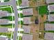 Aerial view of neighborhood with homes, green spaces, and well-maintained yards at 33524 Elm Hill Br, Wesley Chapel, FL 33545