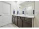 Spacious bathroom featuring a double sink vanity and shower with bright lighting at 33524 Elm Hill Br, Wesley Chapel, FL 33545