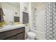 Well-lit bathroom with a shower-tub combo, modern vanity, and decorative accents at 33524 Elm Hill Br, Wesley Chapel, FL 33545