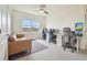 Versatile room featuring desks and comfortable seating, perfect for work or relaxation at 33524 Elm Hill Br, Wesley Chapel, FL 33545