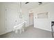 Bedroom showcasing a trendy hanging chair, two closets, and a guitar chords poster on the wall at 33524 Elm Hill Br, Wesley Chapel, FL 33545
