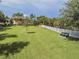 A community dog park with benches and lush grass provides a great place for furry friends and their owners to enjoy at 33524 Elm Hill Br, Wesley Chapel, FL 33545
