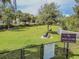 Aerial view of a community dog park with benches and lush green grass for dogs and owners to enjoy at 33524 Elm Hill Br, Wesley Chapel, FL 33545