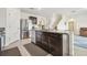 Kitchen island with granite countertops, stainless steel appliances, and a view to the living room at 33524 Elm Hill Br, Wesley Chapel, FL 33545