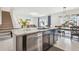 Modern kitchen with an island, granite countertops and stainless steel dishwasher at 33524 Elm Hill Br, Wesley Chapel, FL 33545
