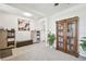 Bright living room with a large window, comfortable seating, and stylish decor at 33524 Elm Hill Br, Wesley Chapel, FL 33545