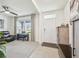 Bright living room with a large window, comfortable seating, and stylish decor at 33524 Elm Hill Br, Wesley Chapel, FL 33545