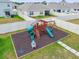 Backyard playground with a slide, swings, and climbing area, perfect for children at 33524 Elm Hill Br, Wesley Chapel, FL 33545