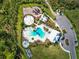 An aerial view shows a pool, splash pad, and playground in a new residential community at 33524 Elm Hill Br, Wesley Chapel, FL 33545