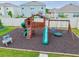 Well-maintained backyard playground with a slide, swings, and a safe play area at 33524 Elm Hill Br, Wesley Chapel, FL 33545