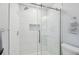 Beautiful bathroom featuring a glass enclosed tiled shower with rainfall shower head at 3737 Gaviota Dr, Sun City Center, FL 33573