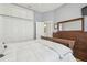 Cozy bedroom featuring a large bed, closet space, and wooden dresser at 3737 Gaviota Dr, Sun City Center, FL 33573