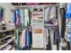 Walk-in closet featuring ample shelving and hanging space for clothes and accessories at 3737 Gaviota Dr, Sun City Center, FL 33573