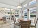 Dining area with views of the pool and outdoor seating, perfect for entertaining at 3737 Gaviota Dr, Sun City Center, FL 33573