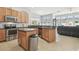 Well-equipped kitchen with stainless steel appliances, granite countertops, and a functional island at 3737 Gaviota Dr, Sun City Center, FL 33573