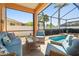 Inviting lanai with comfortable seating, offering a tranquil spot to unwind and enjoy views of the pool at 3737 Gaviota Dr, Sun City Center, FL 33573