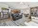 Open-concept living space with a kitchen, dining area, and living room with vaulted ceilings at 3737 Gaviota Dr, Sun City Center, FL 33573