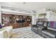 Spacious living area featuring a custom built-in entertainment center and comfortable seating at 3737 Gaviota Dr, Sun City Center, FL 33573