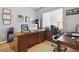 Office with a wooden desk, leather chair, and plenty of natural light from the window at 3737 Gaviota Dr, Sun City Center, FL 33573