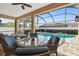 Charming patio area with ample seating, ideal for outdoor dining and socializing with friends and Gathering at 3737 Gaviota Dr, Sun City Center, FL 33573