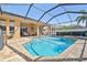 Relaxing screened-in pool and patio area with brick pavers, perfect for outdoor entertaining and enjoying sunny days at 3737 Gaviota Dr, Sun City Center, FL 33573