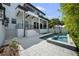Expansive backyard with a pool and spa, featuring a built-in outdoor kitchen, ideal for entertaining at 403 E Davis Blvd, Tampa, FL 33606