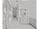 Spacious primary bathroom with dual sinks, walk-in shower, and marble flooring at 403 E Davis Blvd, Tampa, FL 33606