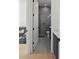 Stylish bathroom featuring a glass-enclosed shower, dark vanity with white countertops, and modern fixtures at 403 E Davis Blvd, Tampa, FL 33606