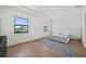 Spacious primary bedroom with hardwood floors, natural light and an upholstered headboard at 403 E Davis Blvd, Tampa, FL 33606