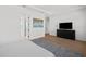 Large primary bedroom with en-suite access, stylish rug, and large dresser at 403 E Davis Blvd, Tampa, FL 33606