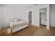 Bedroom features a view to the bathroom and walk in closet, wood floors and neutral colors at 403 E Davis Blvd, Tampa, FL 33606