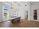 Elegant dining room with tray ceiling, modern lighting, and large windows at 403 E Davis Blvd, Tampa, FL 33606